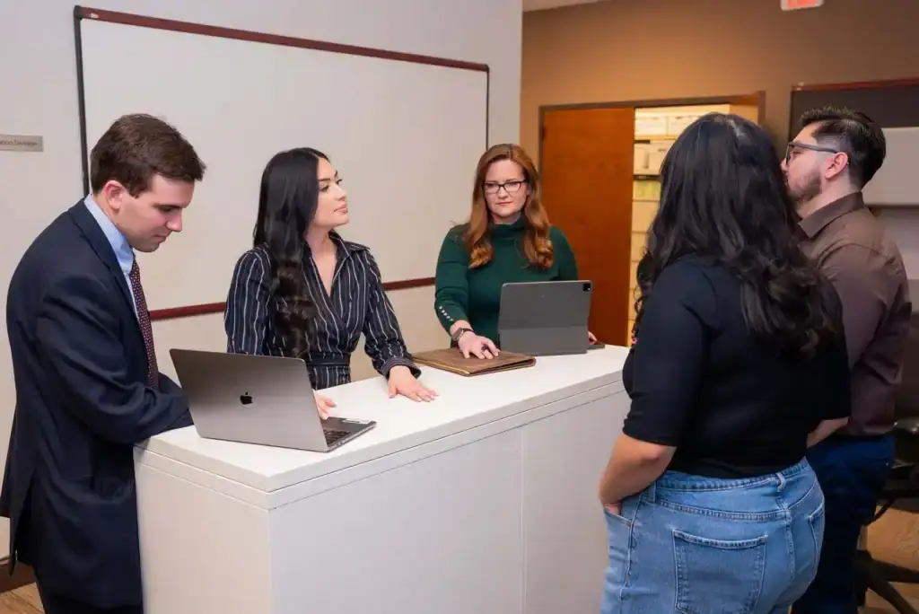 Legal professionals consulting clients at Bonano & Associates law firm.