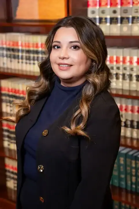 Professional female attorney in law library, legal expertise, Bonano & Associates.
