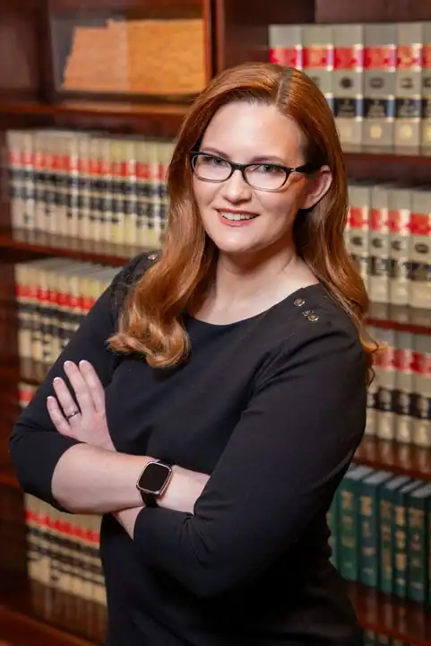 Bonano & Associates legal team in a law library setting.