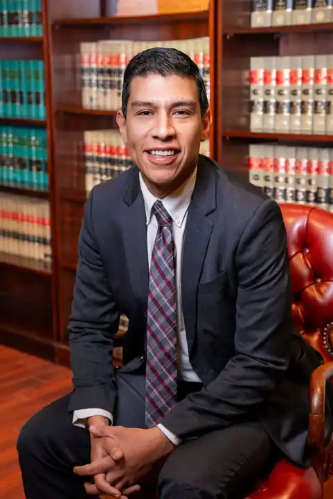 Lawyer in a library surrounded by legal books, representing legal expertise and professional legal s.