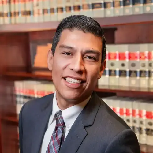 Lawyer in a library with legal books, professional legal services, Bonano & Associates.